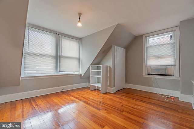 116 Price St, West Chester, PA 19382 - additional living space with wood-type flooring, baseboards, lofted ceiling, and cooling unit