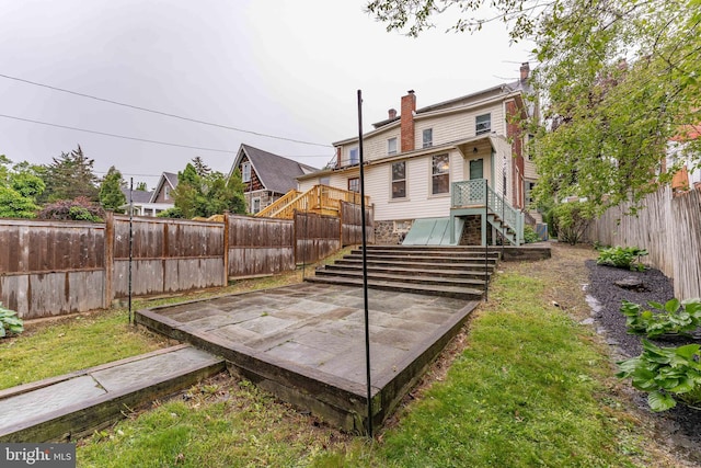116 Price St, West Chester, PA 19382 - rear view of house featuring a fenced backyard and a chimney