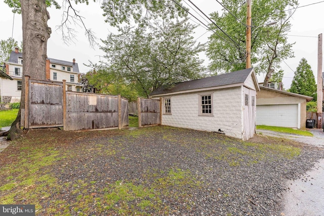 116 Price St, West Chester, PA 19382 - view of yard featuring an outbuilding and a detached garage