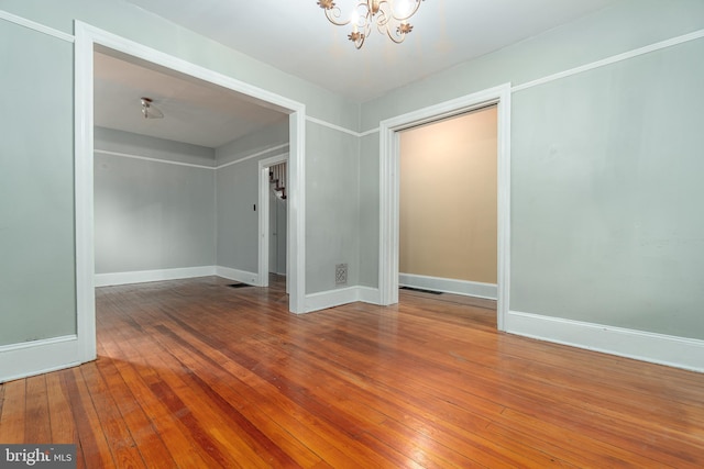 116 Price St, West Chester, PA 19382 - spare room with a chandelier, hardwood / wood-style floors, and baseboards