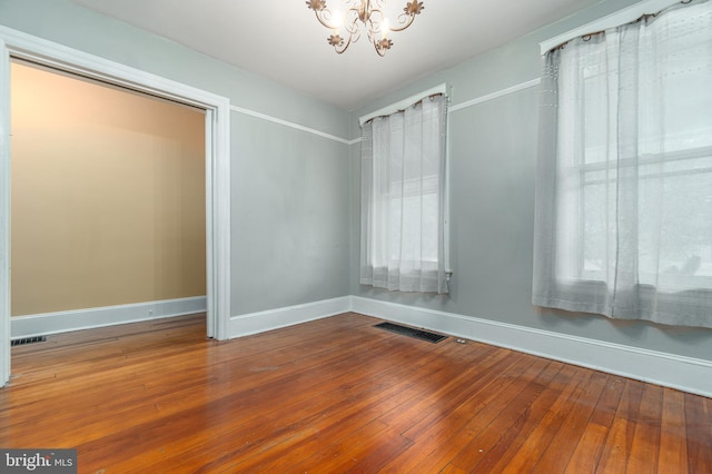 116 Price St, West Chester, PA 19382 - unfurnished room featuring a chandelier, hardwood / wood-style flooring, and baseboards