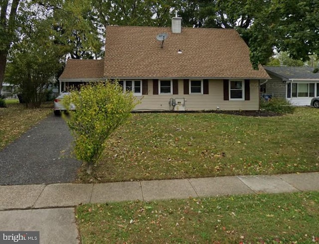 33 Middlebury Ln, Willingboro, NJ 08046 - view of front of home featuring a chimney and a front lawn