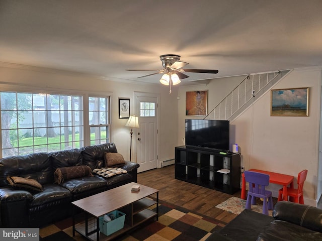33 Middlebury Ln, Willingboro, NJ 08046 - living area featuring a baseboard heating unit, ceiling fan, dark wood-type flooring, crown molding, and stairway