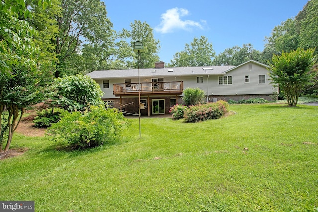 1021 Carson Dr, Huntingtown, MD 20639 - back of house featuring a deck, a lawn, and a chimney