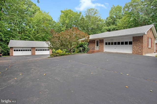 1021 Carson Dr, Huntingtown, MD 20639 - view of front of property featuring brick siding and a detached garage