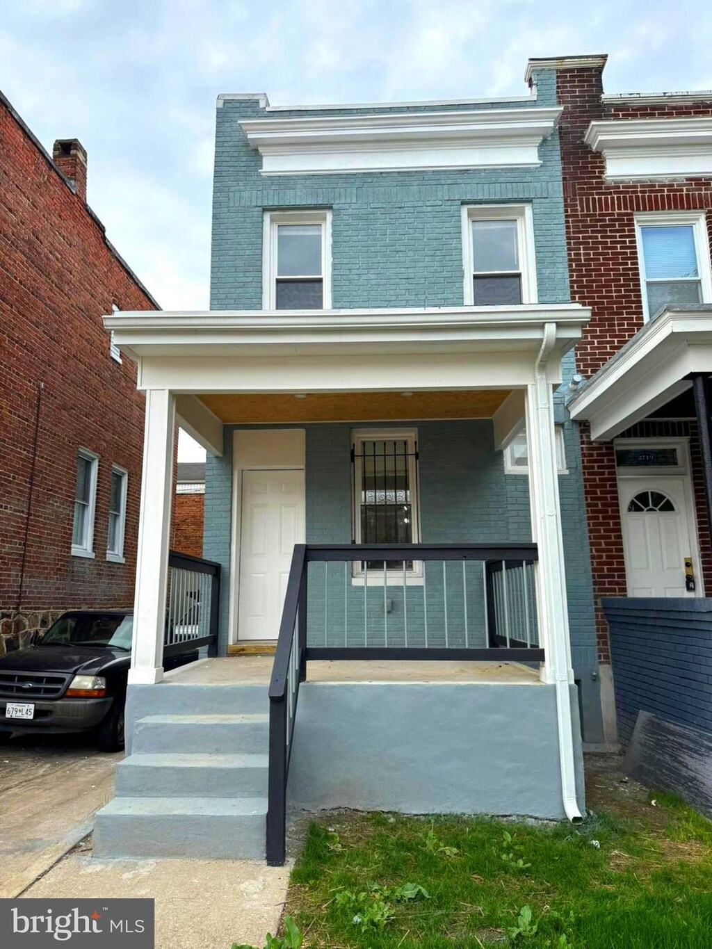 2717 Wilkens Ave, Baltimore, MD 21223 - view of front of property with a porch and brick siding