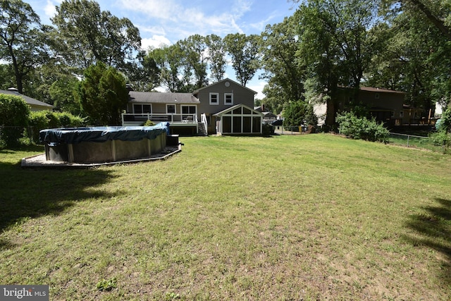 194 Irene Ave, Pasadena, MD 21122 - view of yard with a sunroom, a covered pool, and a deck