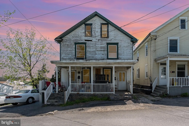 346 W Burkhart Ave, Chambersburg, PA 17201 - view of front facade with covered porch and stone siding