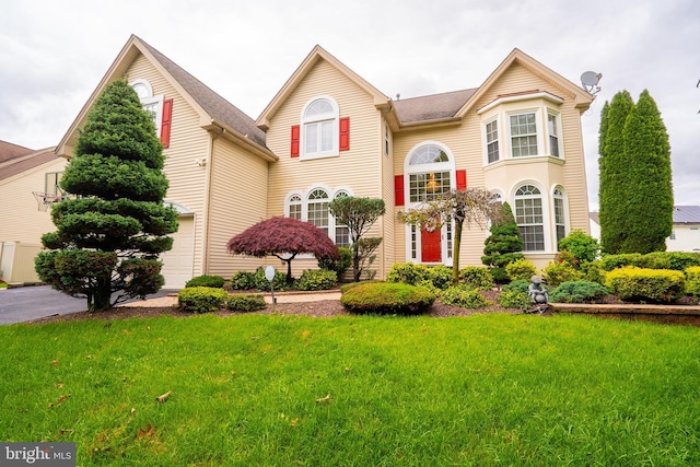 4 Bernadette Cir, Monmouth Junction, NJ 08852 - view of front of house featuring a front lawn and a garage