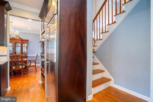 4 Bernadette Cir, Monmouth Junction, NJ 08852 - stairs with crown molding, wood finished floors, baseboards, a chandelier, and recessed lighting
