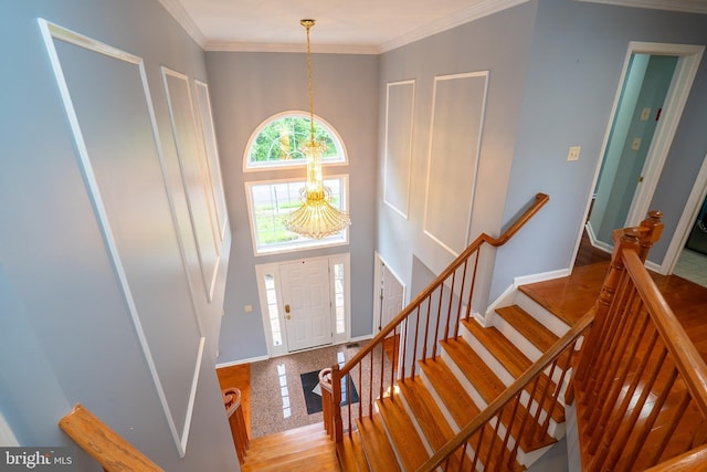 4 Bernadette Cir, Monmouth Junction, NJ 08852 - entrance foyer featuring a chandelier, baseboards, stairway, ornamental molding, and granite floors