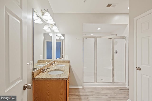 7222 Elkridge Crossing Way, Elkridge, MD 21075 - bathroom with a shower stall, double vanity, and baseboards