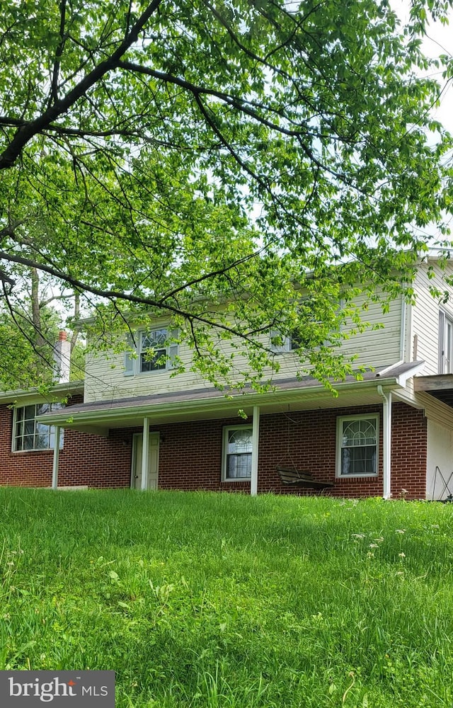 109 Sandy Ln, Bellefonte, PA 16823 - view of front of property with brick siding and a front yard