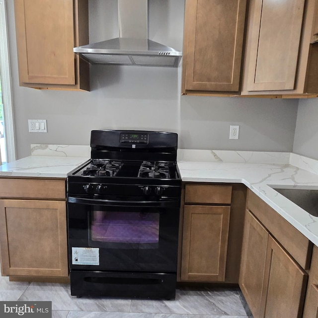 9711 Dilston Rd, Silver Spring, MD 20903 - kitchen with black gas stove, wall chimney exhaust hood, and light stone counters