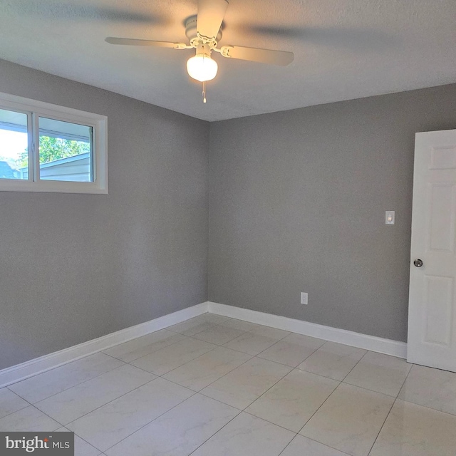 9711 Dilston Rd, Silver Spring, MD 20903 - empty room featuring ceiling fan, baseboards, and light tile patterned floors