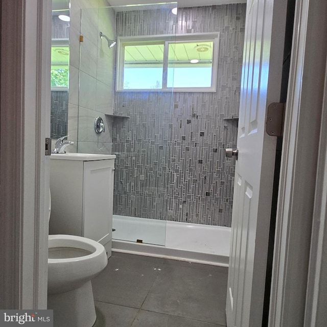 9711 Dilston Rd, Silver Spring, MD 20903 - bathroom featuring a tile shower, tile patterned floors, vanity, and toilet