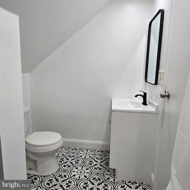 9711 Dilston Rd, Silver Spring, MD 20903 - bathroom with vanity, toilet, tile patterned floors, and baseboards