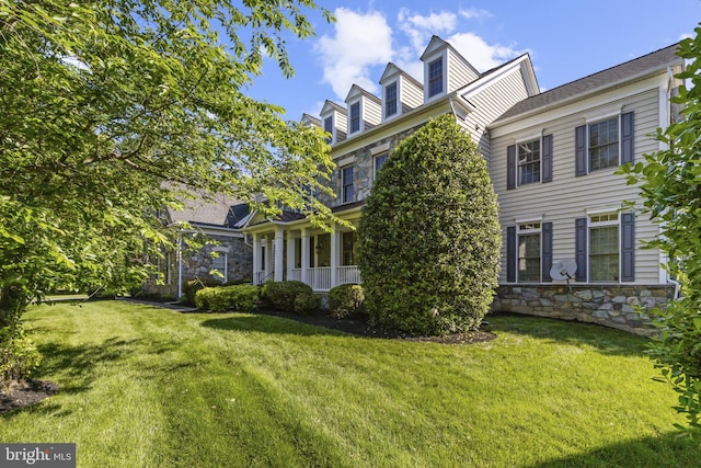 17621 Auburn Village Dr, Sandy Spring, MD 20860 - view of side of home with stone siding and a lawn