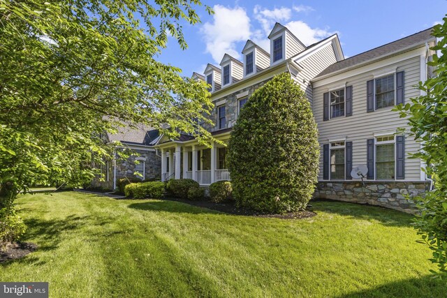 17621 Auburn Village Dr, Sandy Spring, MD 20860 - view of side of home with stone siding and a lawn