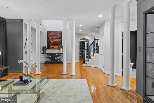 17621 Auburn Village Dr, Sandy Spring, MD 20860 - exercise room featuring ornate columns, light wood-style flooring, recessed lighting, and baseboards