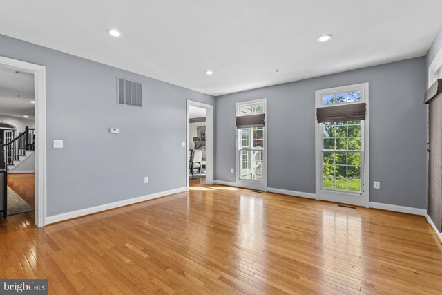 17621 Auburn Village Dr, Sandy Spring, MD 20860 - unfurnished room with light wood-style flooring, baseboards, stairs, and recessed lighting
