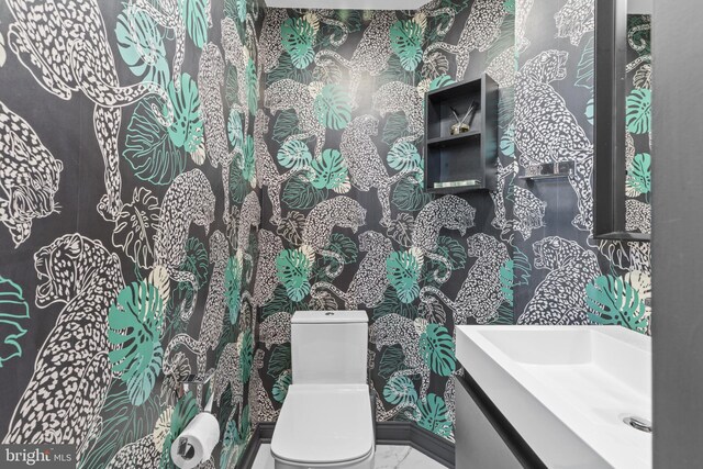 17621 Auburn Village Dr, Sandy Spring, MD 20860 - bathroom featuring toilet, wallpapered walls, and vanity