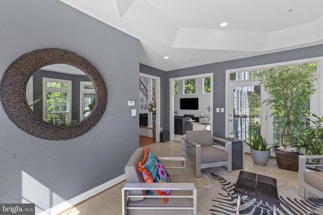 17621 Auburn Village Dr, Sandy Spring, MD 20860 - tiled living area featuring baseboards, a tray ceiling, recessed lighting, and a textured wall