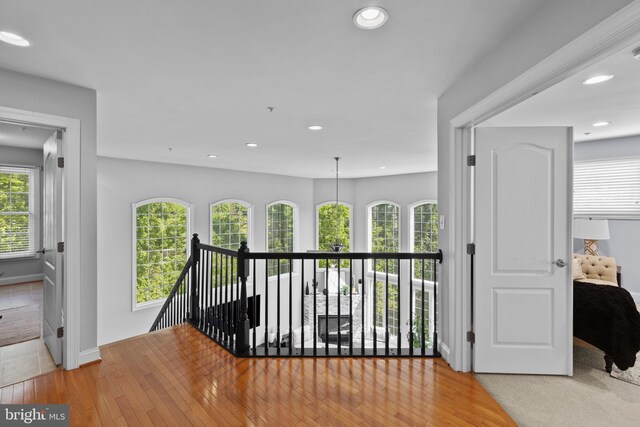17621 Auburn Village Dr, Sandy Spring, MD 20860 - hall with an upstairs landing, healthy amount of natural light, light wood-style floors, recessed lighting, and baseboards