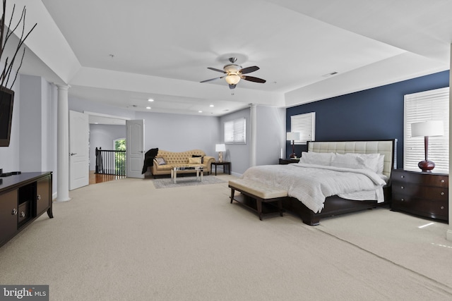 17621 Auburn Village Dr, Sandy Spring, MD 20860 - carpeted bedroom with decorative columns, a tray ceiling, a ceiling fan, and recessed lighting