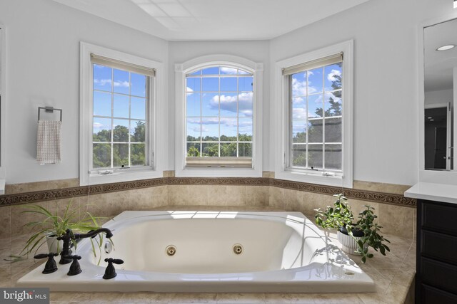 17621 Auburn Village Dr, Sandy Spring, MD 20860 - bathroom with a tub with jets and vanity