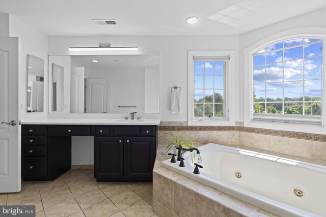 17621 Auburn Village Dr, Sandy Spring, MD 20860 - bathroom with a jetted tub, tile patterned flooring, vanity, and recessed lighting