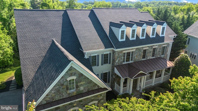 17621 Auburn Village Dr, Sandy Spring, MD 20860 - view of front of property with stone siding, a porch, and a standing seam roof