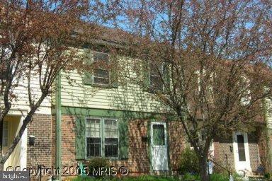 view of side of home with brick siding
