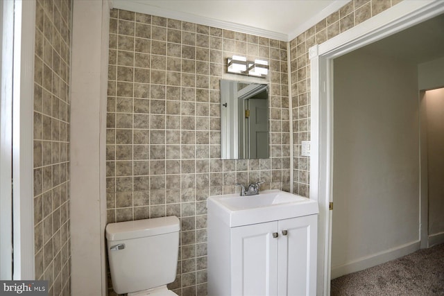 21 E Allen St, Mechanicsburg, PA 17055 - half bathroom featuring crown molding, vanity, toilet, tile walls, and baseboards
