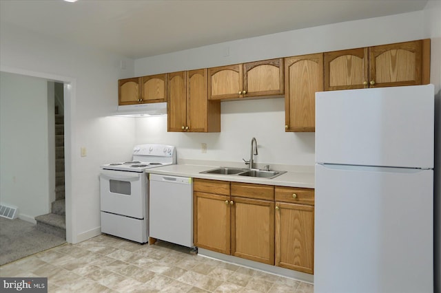 21 E Allen St, Mechanicsburg, PA 17055 - kitchen featuring white appliances, a sink, under cabinet range hood, light countertops, and brown cabinets