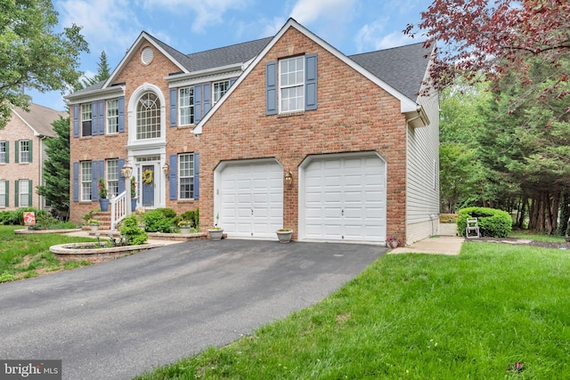 8139 Showcase Ct, Pasadena, MD 21122 - view of front of house with an attached garage, driveway, brick siding, and a front lawn