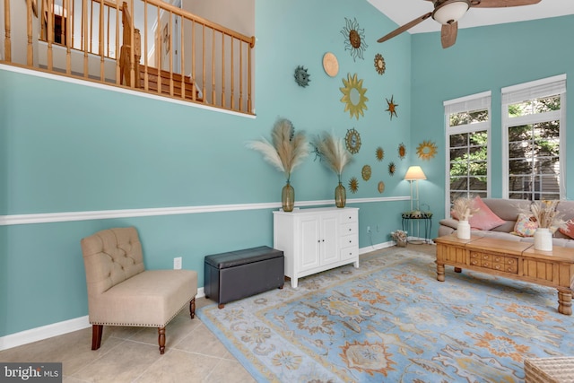 8139 Showcase Ct, Pasadena, MD 21122 - sitting room featuring ceiling fan, high vaulted ceiling, baseboards, and tile patterned floors