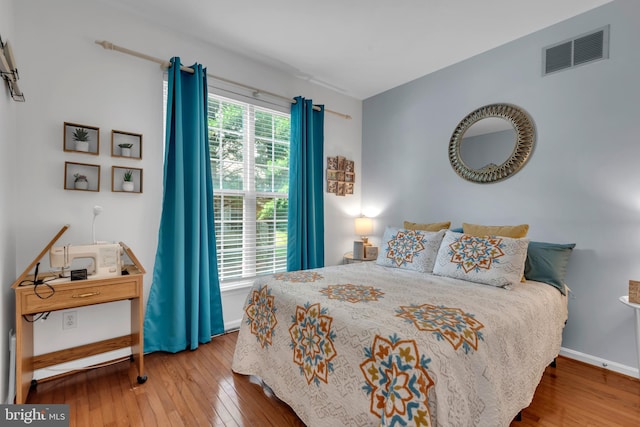 8139 Showcase Ct, Pasadena, MD 21122 - bedroom with wood-type flooring and baseboards