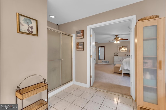 8139 Showcase Ct, Pasadena, MD 21122 - ensuite bathroom featuring ceiling fan, a shower stall, tile patterned floors, and baseboards