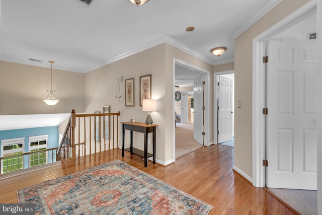 8139 Showcase Ct, Pasadena, MD 21122 - corridor featuring an upstairs landing, wood finished floors, ornamental molding, and baseboards