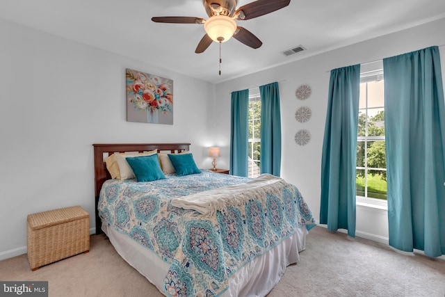 8139 Showcase Ct, Pasadena, MD 21122 - carpeted bedroom with multiple windows, baseboards, and a ceiling fan