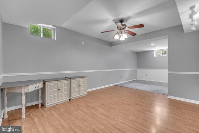 8139 Showcase Ct, Pasadena, MD 21122 - below grade area featuring plenty of natural light, ceiling fan, and wood finished floors