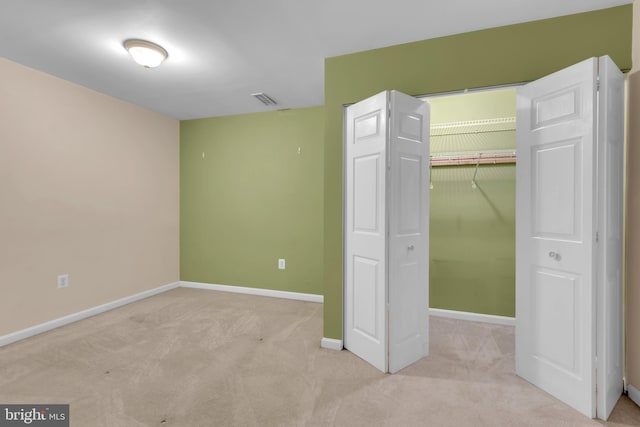8139 Showcase Ct, Pasadena, MD 21122 - unfurnished bedroom with baseboards, carpet floors, a closet, and a spacious closet