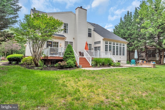 8139 Showcase Ct, Pasadena, MD 21122 - back of house featuring a deck, a chimney, a patio area, and a yard