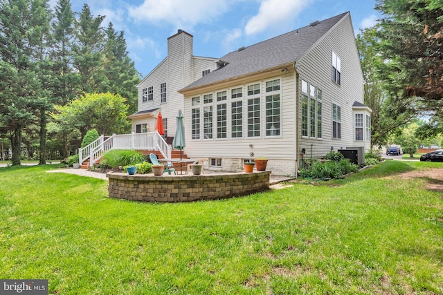 8139 Showcase Ct, Pasadena, MD 21122 - back of house with a lawn, a patio area, a chimney, stairs, and a deck
