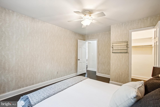 1712 W Abingdon Dr Unit 102, Alexandria, VA 22314 - bedroom with dark wood finished floors, baseboards, ceiling fan, and a spacious closet