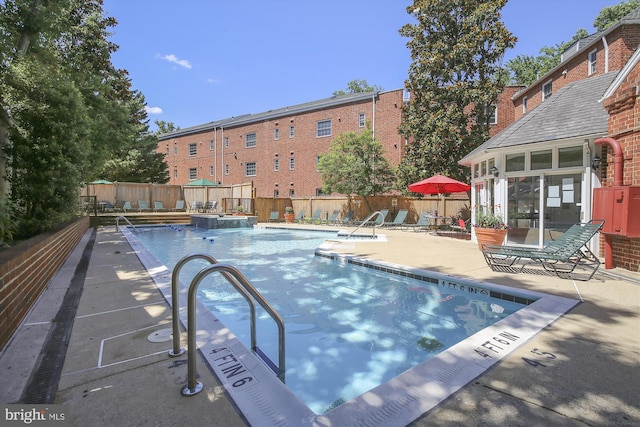 1712 W Abingdon Dr Unit 102, Alexandria, VA 22314 - community pool with a fenced backyard, a patio, and an outdoor hot tub