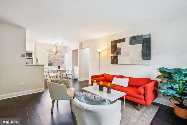 1712 W Abingdon Dr Unit 102, Alexandria, VA 22314 - living room featuring a chandelier, baseboards, and dark wood finished floors