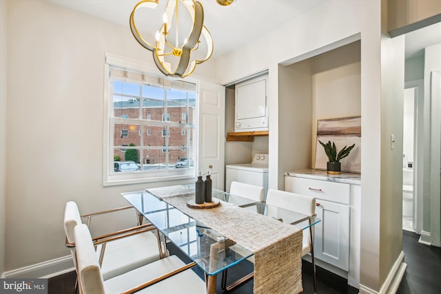 1712 W Abingdon Dr Unit 102, Alexandria, VA 22314 - dining room featuring stacked washer / dryer, a chandelier, baseboards, and dark wood-style floors