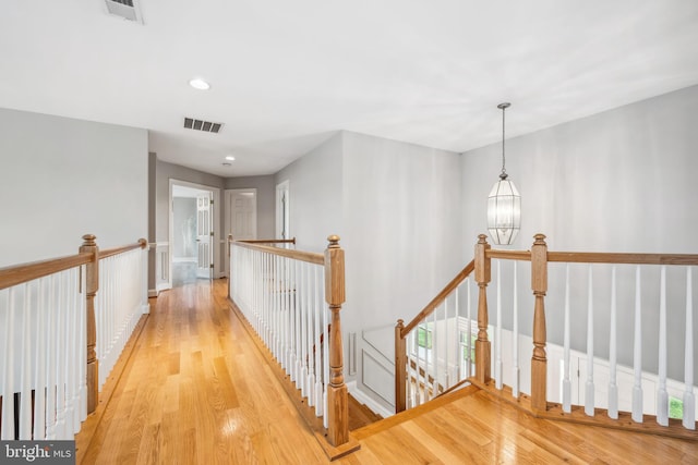 301 Nottingham Ln, Queenstown, MD 21658 - hallway featuring an upstairs landing, light wood finished floors, and recessed lighting